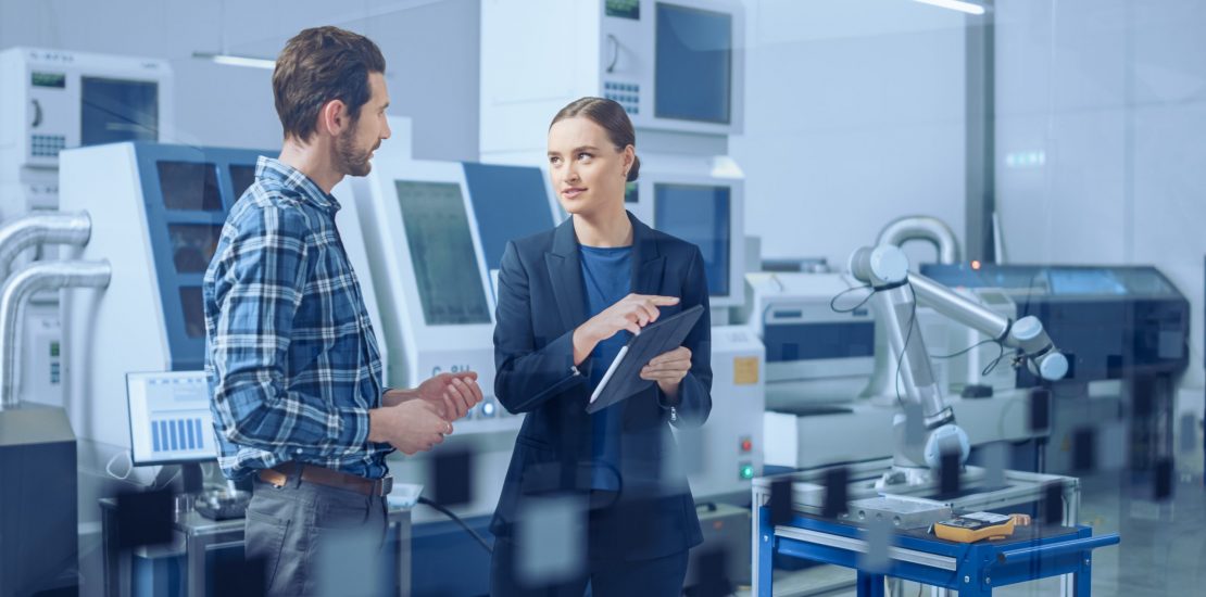 Modern,Factory:,Female,Project,Manager,And,Male,Engineer,Standing,,Talking, Modern,Factory:,Female,Project,Manager,And,Male,Engineer,Standing,,Talking,